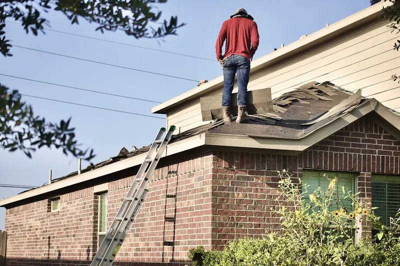 Professional roofer working on a residential roof in Hesperia